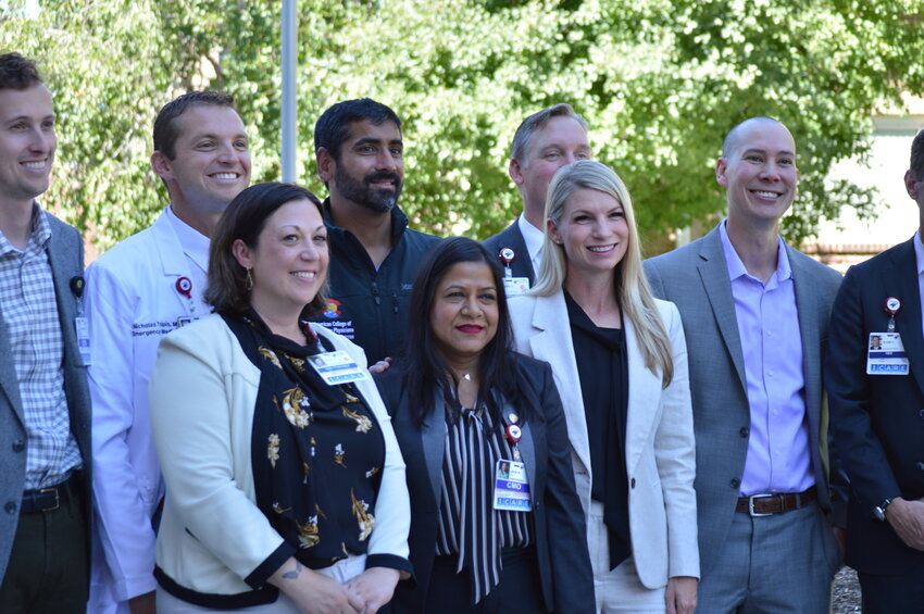 Democratic U.S. Rep. Brittany Pettersen smiles alongside health professionals on Aug. 31, 2023, at the Swedish Medical Center in Englewood. Pettersen announced the Hospitals As Naloxone Distribution Sites (HANDS) Act, which aims to increase access to the medicine naloxone.